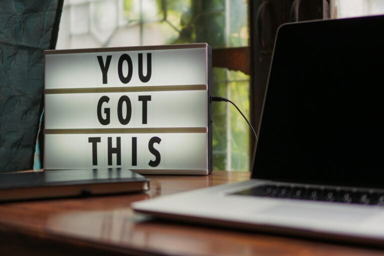 Motivational light box sign 'You Got This' next to laptop for workspace inspiration