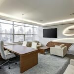 Sleek executive office with curved walls and city view for ultimate productivity