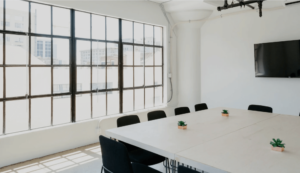 Minimalist meeting room with large windows and sleek table