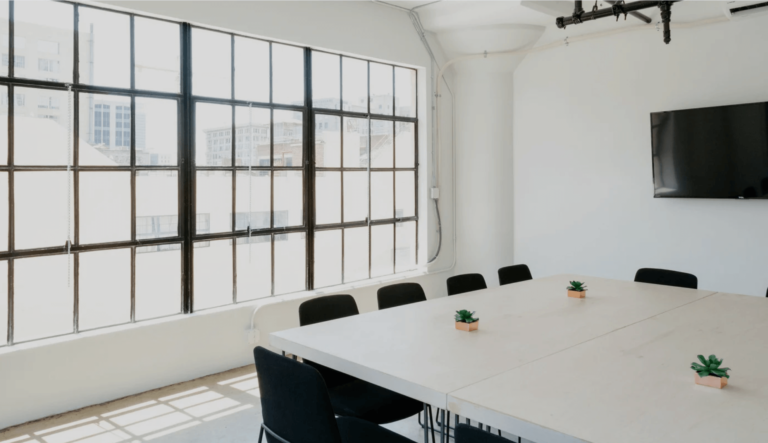 Minimalist meeting room with large windows and sleek table