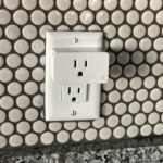 Hexagon tile backsplash with modern electrical outlet for stylish home design