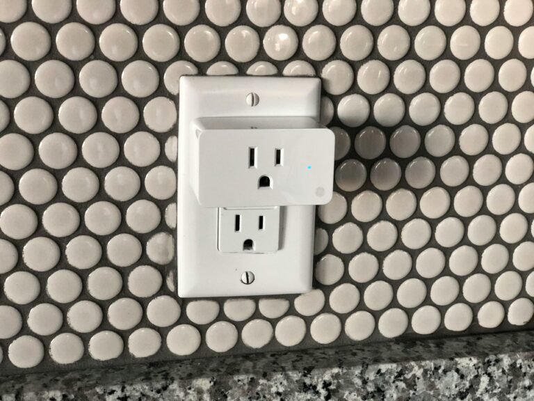 Hexagon tile backsplash with modern electrical outlet for stylish home design