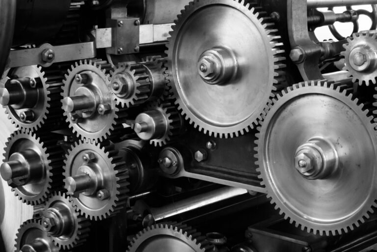 Industrial close-up of interlocking gears representing precision engineering, automation, and mechanical efficiency.