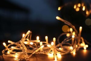 Warm LED string lights glowing softly in the dark, perfect for creating a cozy ambiance in any space with energy-efficient lighting.