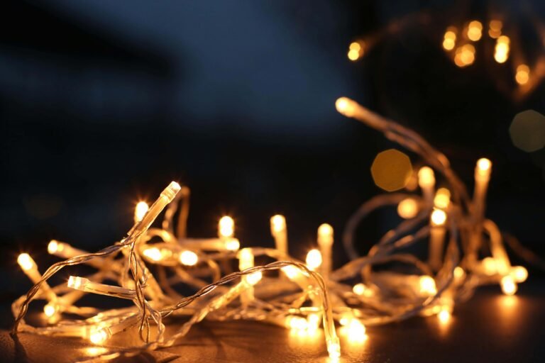 Warm LED string lights glowing softly in the dark, perfect for creating a cozy ambiance in any space with energy-efficient lighting.
