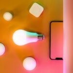 Smart LED bulb with wireless control hub and accessories displayed on a vibrant background, representing modern smart lighting technology and home automation.