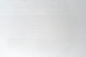 Close-up of white textured surface with subtle patterns