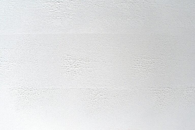 Close-up of white textured surface with subtle patterns