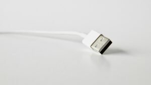 White USB cable on a plain surface