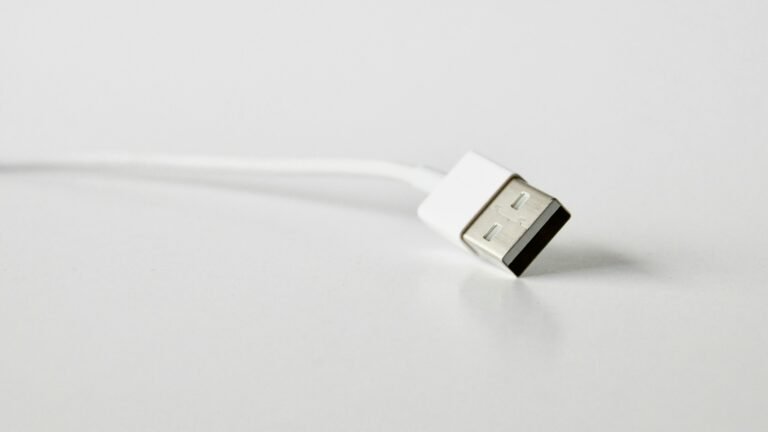 White USB cable on a plain surface