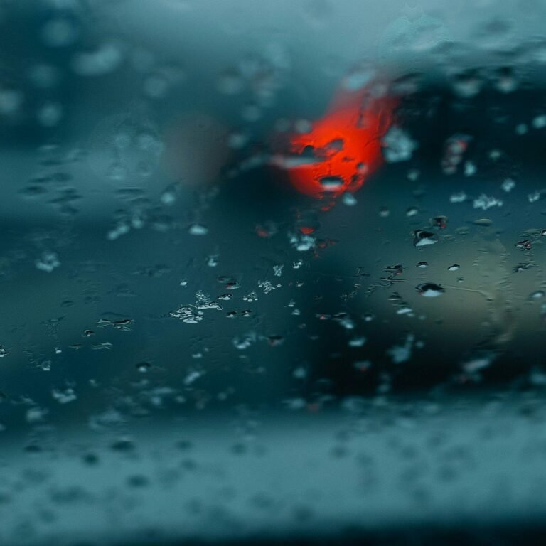 Close-up of water droplets on a blurry window or surface