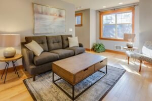 Bright living area featuring a comfortable sofa and chic center table.