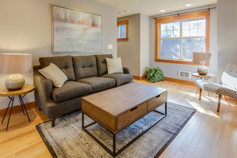 Bright living area featuring a comfortable sofa and chic center table.