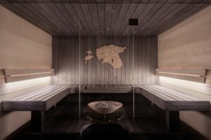 All-cedar sauna room with benches and soft ambient lighting.