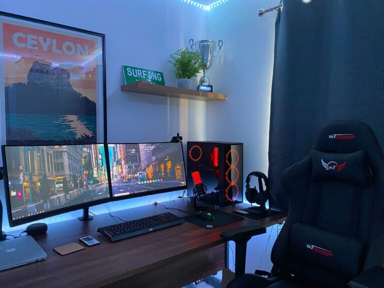 Dual-monitor desk arrangement with gaming chair and accessories.