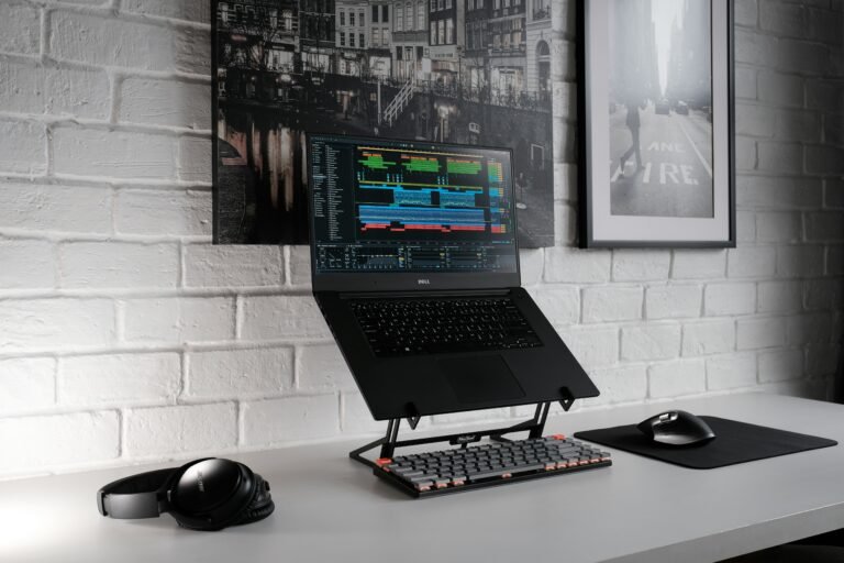 Home office desk with laptop and modern industrial décor