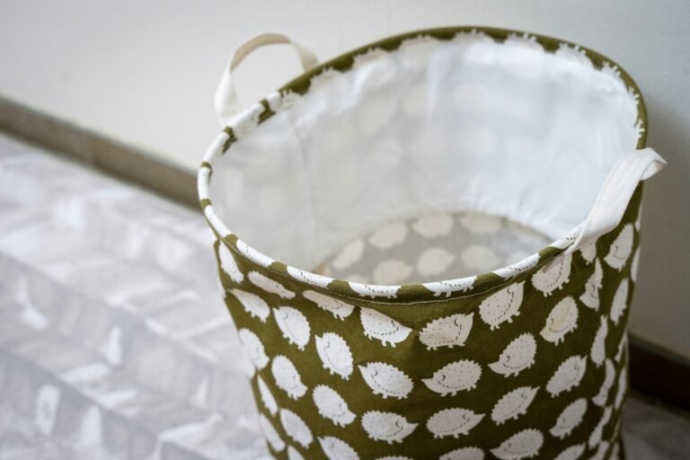 Lightweight fabric basket with white polka dots on a patterned floor.