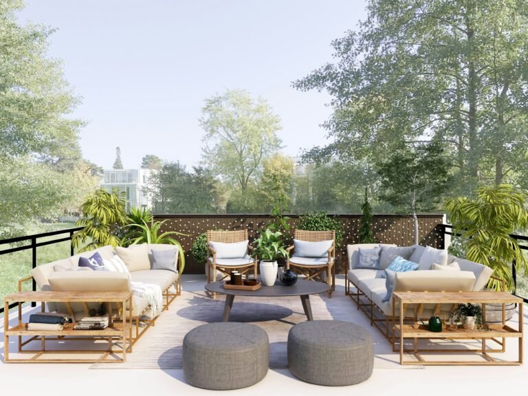 Outdoor seating on a patio overlooking lush greenery.