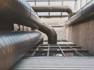Large industrial ventilation ducts on a rooftop.
