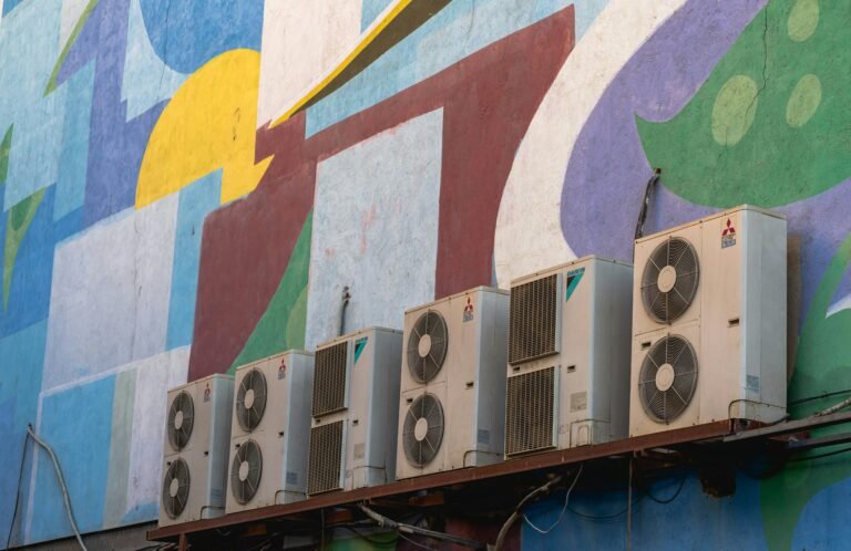 Abstract mural with air conditioners on a vibrant wall