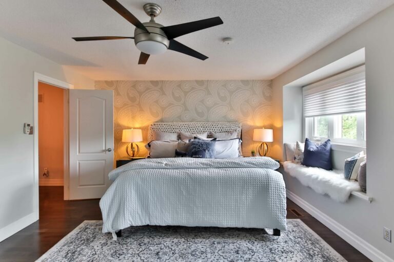 Bedroom with ceiling fan and large bed