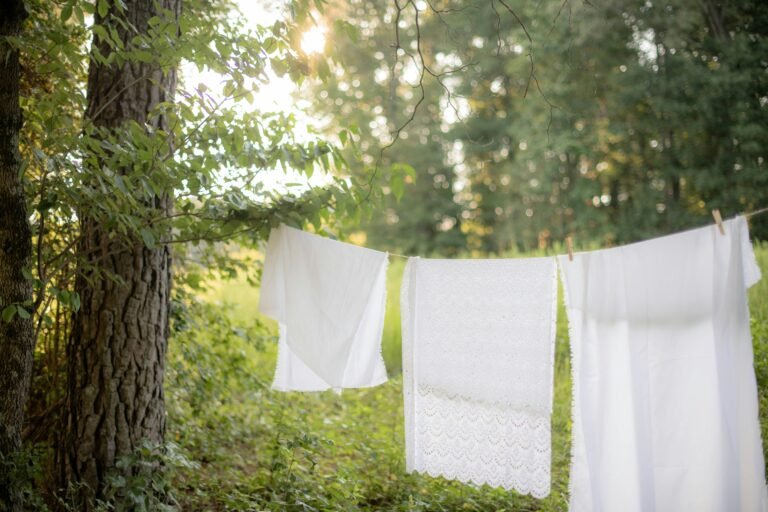 White linens drying on outdoor clothesline