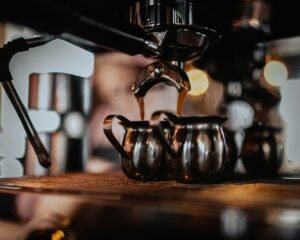 Close-up of an espresso machine as it pours a fresh shot.