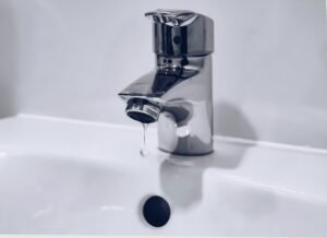 Modern bathroom faucet with running water