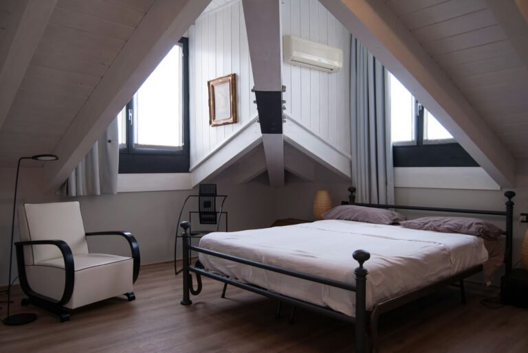 Cozy attic bedroom under a slanted roof.