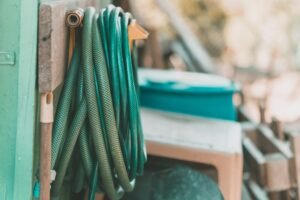 Coiled garden hose on outdoor reel