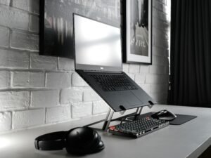 Contemporary desk setup with laptop and headphones
