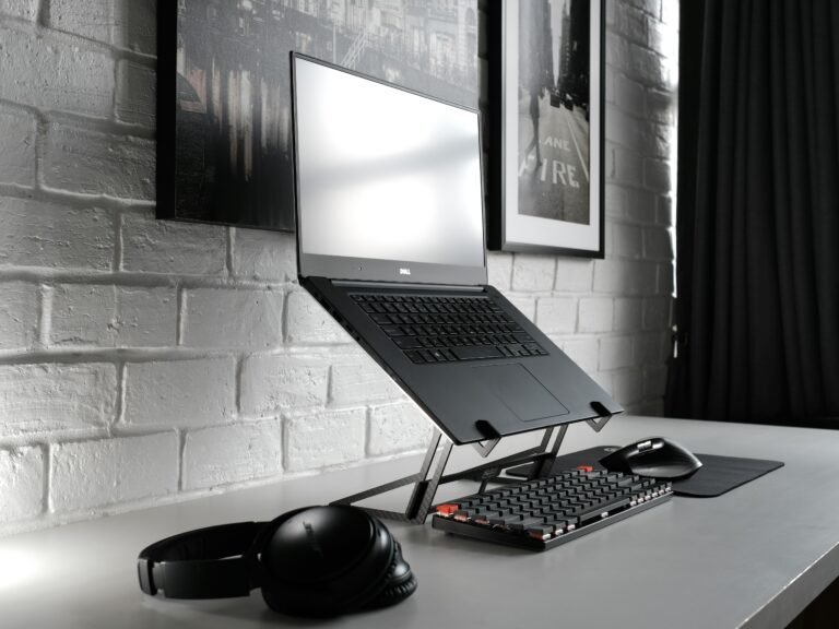 Contemporary desk setup with laptop and headphones