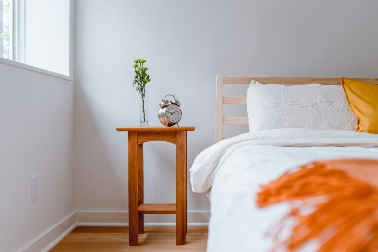 Bedside table with alarm clock and natural light