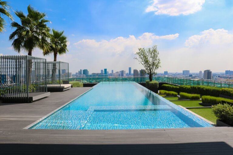 Pool deck with city skyline view