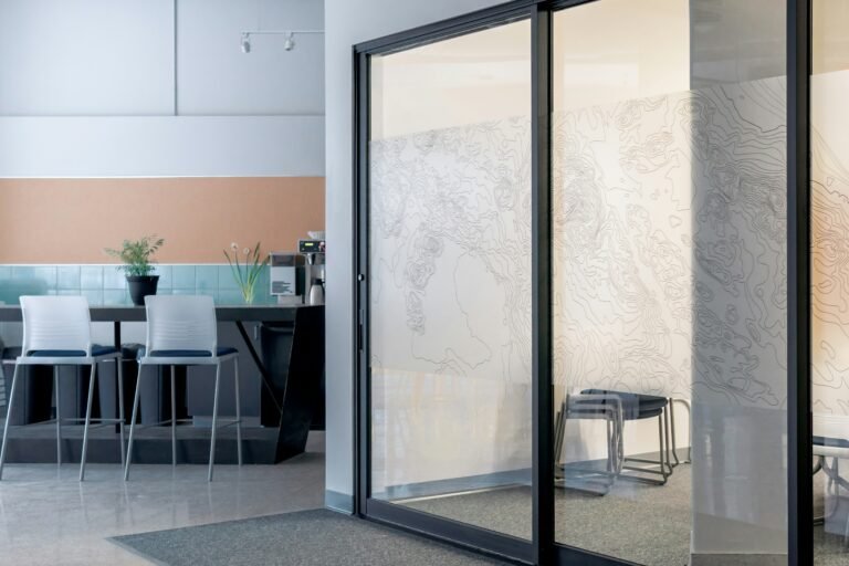 Sleek glass divider in a contemporary workspace