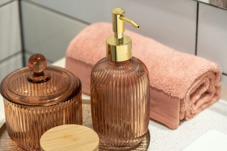 Modern bathroom vanity with decorative dispensers and towels