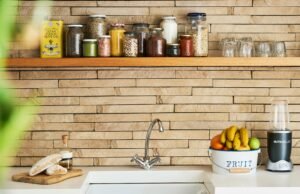 Kitchen shelf with jars and wooden backsplash