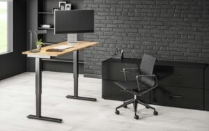 Adjustable standing desk and ergonomic office chair in a contemporary setup.
