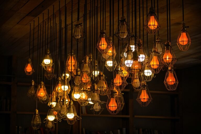Assorted hanging pendant lights, each glowing warmly